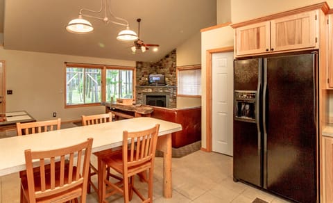 Owen's Outpost - Large kitchen bar and fridge with an ice maker