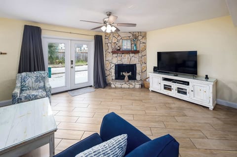 Living room with french door entry and TV