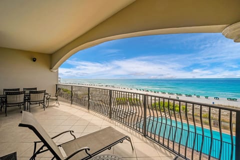 Stunning beachfront balcony where turquoise waves meet white sand, with your private poolside perch for sunsets and morning coffee overlooking paradise.