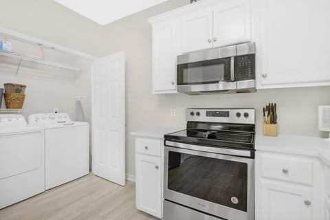Laundry Closet - The spacious laundry closet features a full size washer and dryer for convenience.