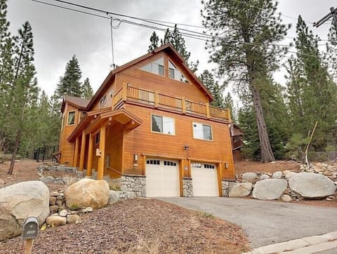 A stunning mountain chalet surrounded by towering pines, your perfect retreat