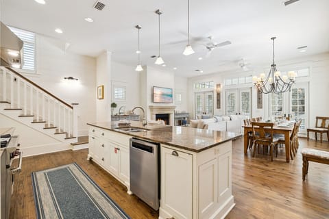 Your open-concept kitchen flows seamlessly into the living and dining areas, creating the perfect space for cooking and entertaining together.