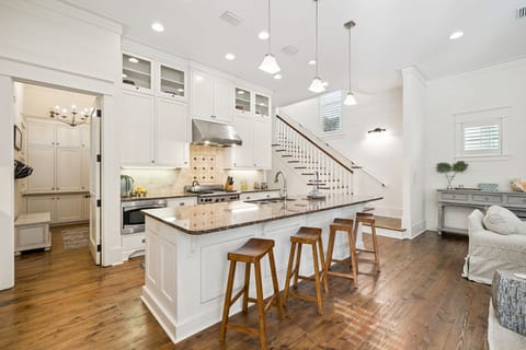 Your gourmet kitchen awaits with granite countertops, stainless appliances, and a spacious island perfect for morning coffee or evening conversations.