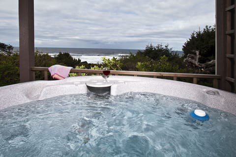 HOT TUB VIEW - Covered hot tub on patio , private setting overlooks the ocean