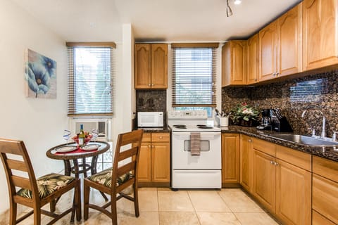 Immaculate Kitchen by Dining Area with Window AC