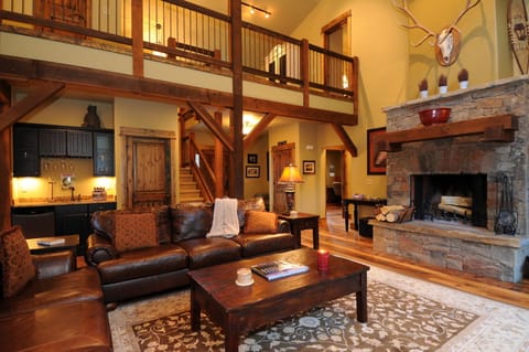 A wet bar and fireplace in the living room.
