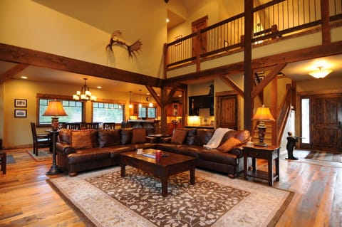 The great room has an amazing bank of windows looking out to the river canyon.