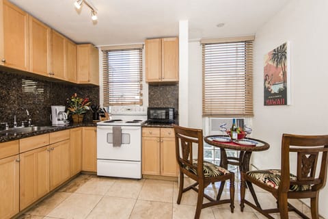 Immaculate Kitchen with Dining Table and Window AC