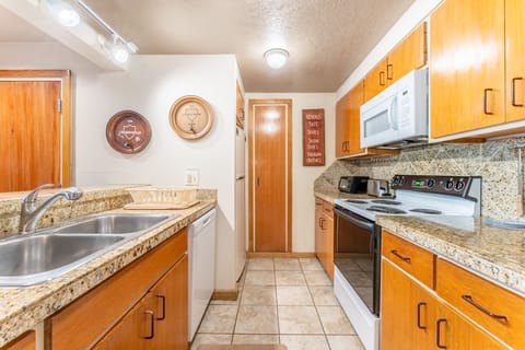 Full size kitchen with granite countertops and everything you need to prepare a meal away from home.