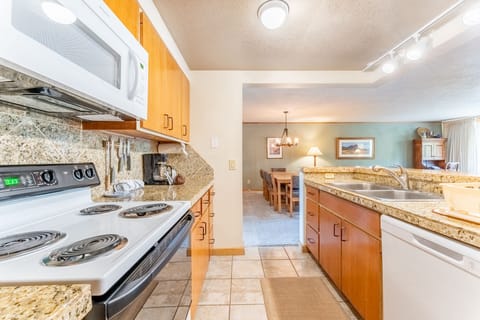 Full size kitchen with granite countertops and everything you need to prepare a meal away from home.