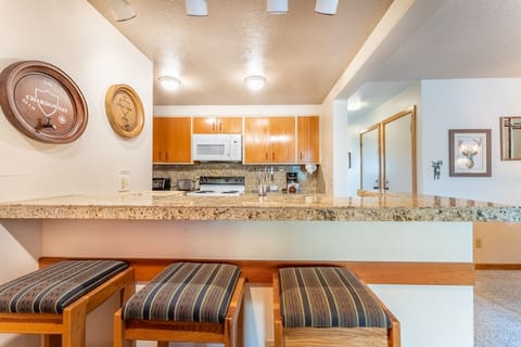 Breakfast bar with additional seating for three.