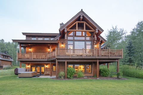 Your stunning log cabin retreat awaits with warm wood beams and expansive windows that frame nature's beauty. Enjoy morning coffee on your private deck or unwind in the hot tub as evening lights create the perfect ambiance.