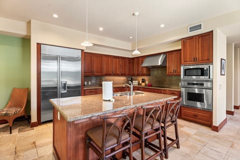 Gourmet Kitchen: Granite countertops, high-end appliances, and a central island perfect for culinary creations
