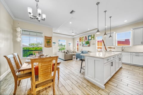 An open-concept sanctuary—kitchen, dining, and living flow together for effortless island living.