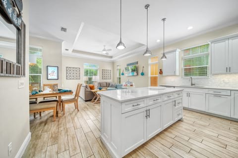 Sweeping view of the main living space—center island, dining table, and relaxed seating all in harmony for unforgettable gatherings.