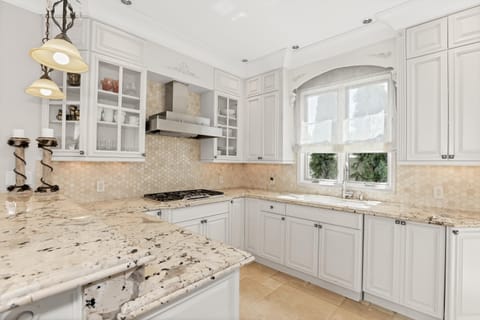 Gourmet kitchen delights the senses with most beautiful granite and state of the art stainless steel appliances