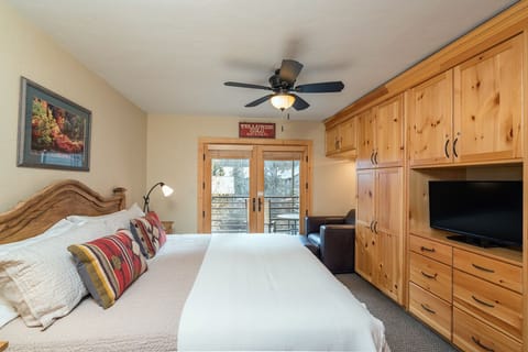 Viking Lodge 212 - the king master bedroom is super cozy and opens to a private balcony overlooking the river.