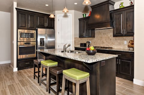 Kitchen - The Kitchen is complete with everything you will need for meal preparations including pots, pans, baking dishes, plates, cups, silverware, cutlery, and an assortment of cooking utensils.