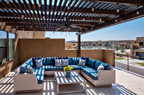 Upstairs Patio Overlooking Community Pool - From the covered patio you can overlook the community pool and watch the kids play and enjoy the neighborhood amenities.