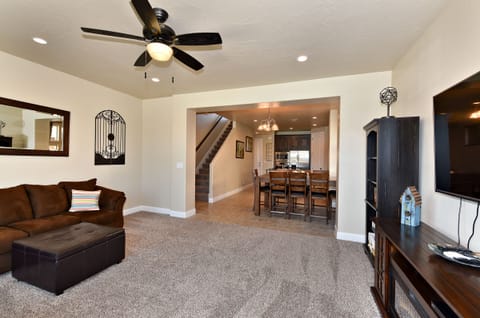 Living Room View - The Living Room is located adjacent to the dining room and is the perfect place to relax and watch your favorite movie or TV program.