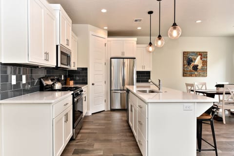 Kitchen - The Kitchen is complete with everything you will need for meal preparations including pots, pans, baking dishes, plates, cups, silverware, cutlery, and an assortment of cooking utensils