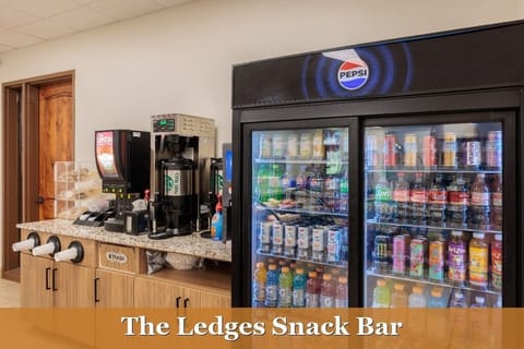 Ledges Snack Bar - Come grab a quick snack, beverage, hot dog, or hamburger at the Ledges Snack Bar located next to the driving range.
