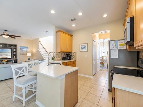 Bright, open kitchen with cozy breakfast bar seating!