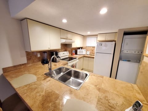 Fully-equipped kitchen with modern appliances and ample counter space.
