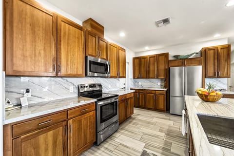Kitchen with Prep Sink, Microwave, and Refrigerator