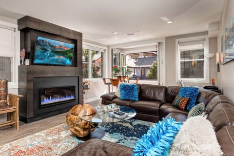 Chic living room large screen TV beautiful gas fireplace gorgeous views