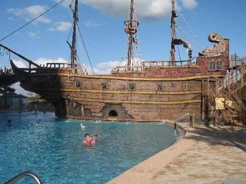 Enjoy you vacation by Pirate ship pool