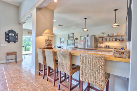 Bar seating overlooking the full kitchen