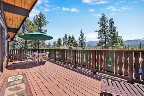 Private outdoor deck with a BBQ surrounded by tall pines, perfect for relaxing under the trees after a day of adventure—enjoy peaceful forest views, fresh air, and a truly rejuvenating stay.
