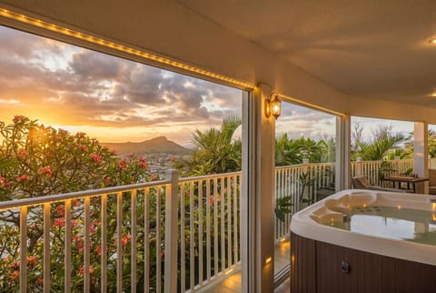 Unwind in your private hot tub while taking in breathtaking panoramic sunsets over the Pacific Ocean