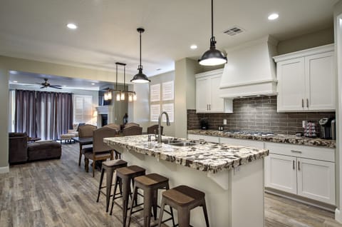 Kitchen - The Kitchen is complete with everything you will need for meal preparations including pots, pans, baking dishes, plates, cups, silverware, cutlery, and an assortment of cooking utensils.