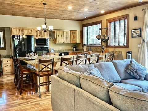 Open floor plan depicting the living, kitchen, and dining area.
