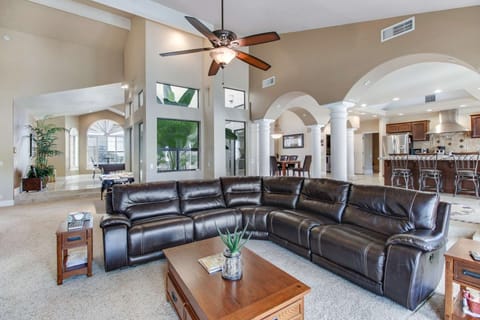 Family room with large sectional couch, flat screen TV and 2 french doors with a view of the backyard!