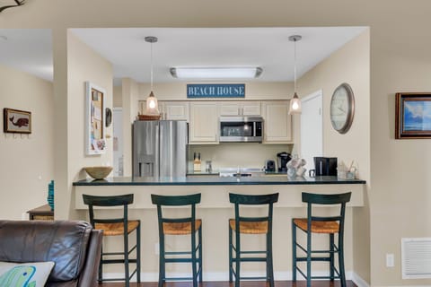Granite countertops and bar seating – perfect for family meals.