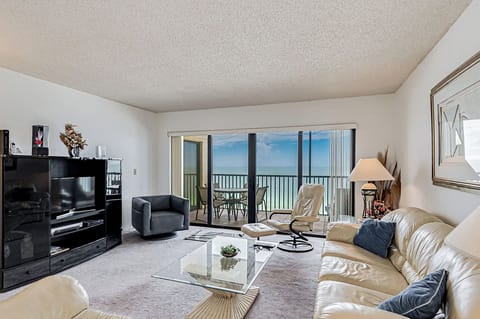 Sink into plush leather seating while watching your favorite shows, then step onto your private balcony to savor endless ocean views.