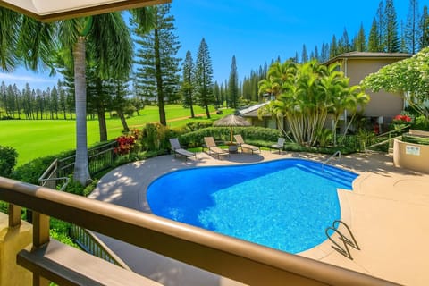 Your resort-pool and tropical-green view sets the tone for splashy mornings and chilled sunset lounging
