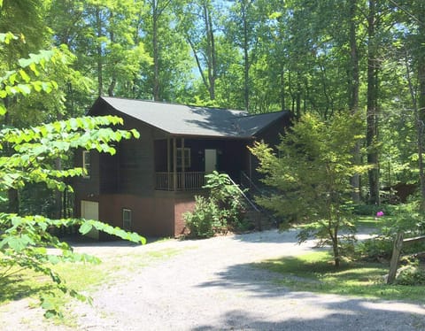 Mtn Shade circle driveway with additional gravel parking beside the house