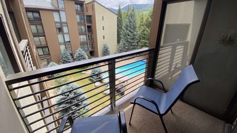 View from the balcony of the bedroom with 2 Queen beds to the pool.