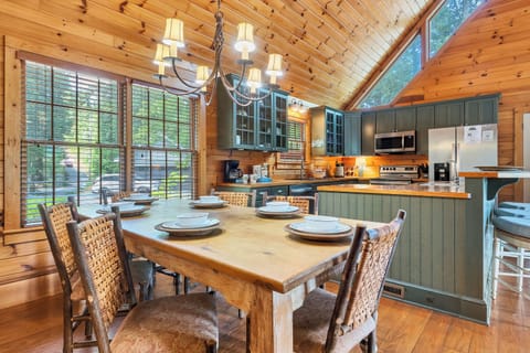 Dining table for six guests plus 3 at the bar.