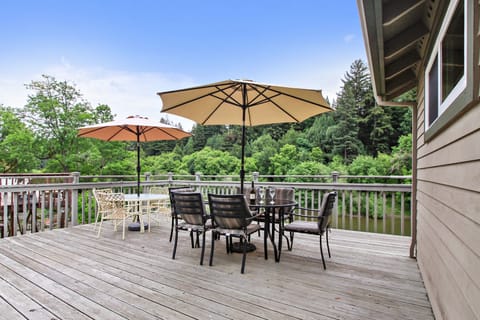 Enjoy river, forest, and mountain views from the deck.