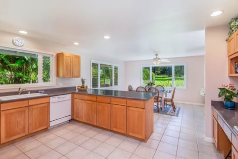 Open space kitchen and dining with golf course views