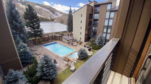 View to the pool from the bedroom with a King and Queen