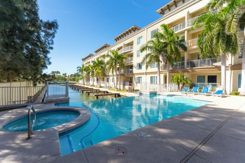 Wake up to waterfront luxury on South Padre Island: Resort-style pool, private docks, palm-lined views, and sun-soaked balconies.
