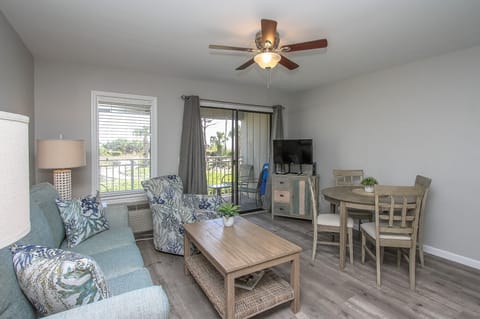 Ocean Dunes 107 - - The Living Room Area has sliding door access to the balcony Pool/Beachfront view ,  dining table seats four . Upscale furnishings and flat screen television complete the space.
