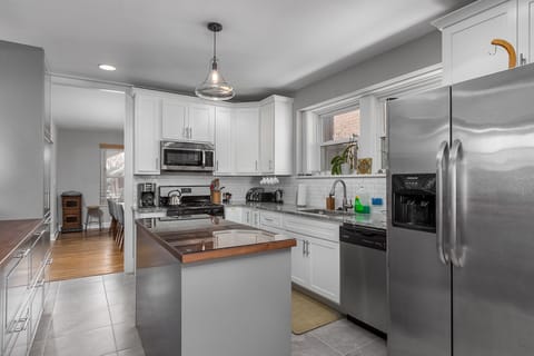 Kitchen is between living and dining rooms. Dining room seats 10.