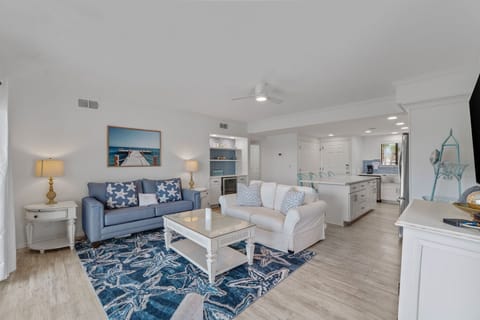 Relax in your spacious coastal retreat with plush seating and nautical touches throughout the open living space.